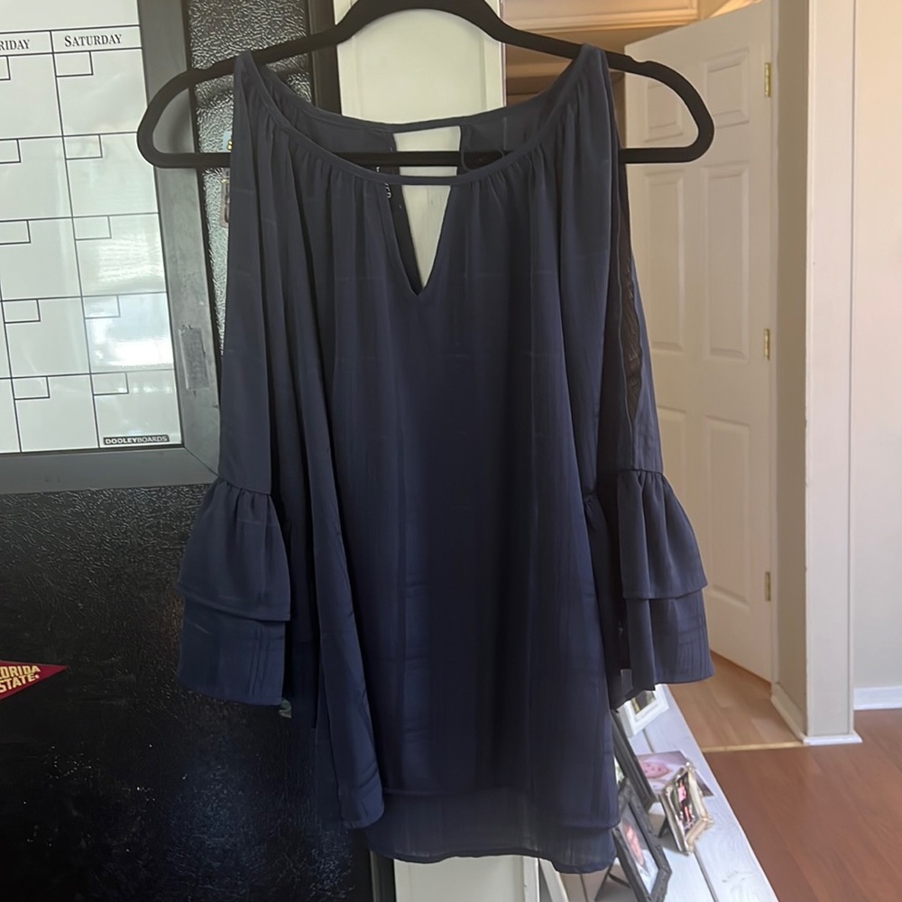 Sheer, open arm top